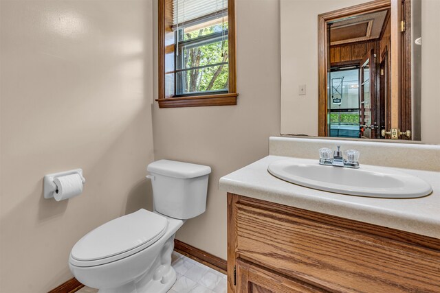 bathroom featuring vanity and toilet