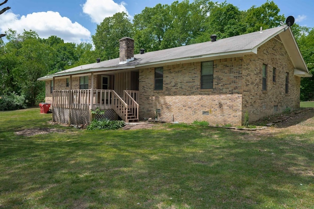 9430 Monasco Rd, Millington, TN 38053 - rear view of house featuring a chimney, a yard, brick siding, and crawl space