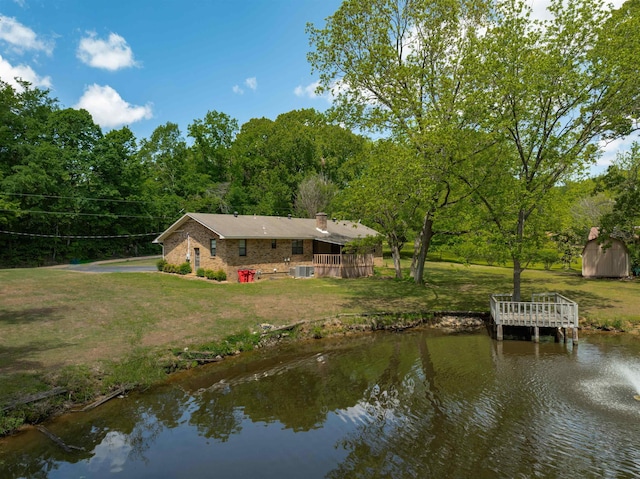 9430 Monasco Rd, Millington, TN 38053 - back of property featuring a lawn, a chimney, a water view, and brick siding