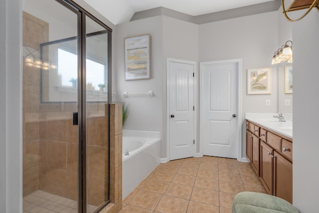 bathroom with separate shower and tub, tile patterned floors, vanity, and lofted ceiling