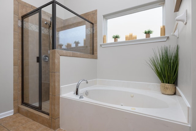 bathroom featuring tile patterned flooring and independent shower and bath