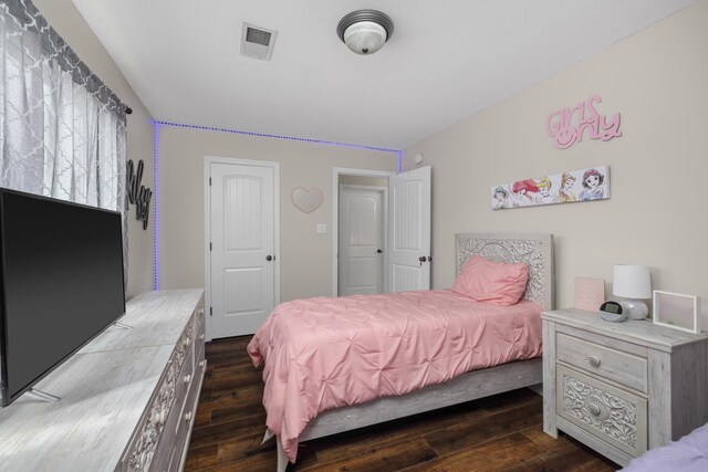 bedroom featuring dark wood-type flooring