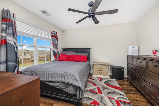 bedroom featuring ceiling fan and dark wood-type flooring