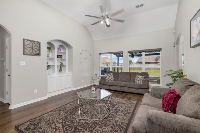 living room with built in shelves, ceiling fan, high vaulted ceiling, and dark wood-type flooring