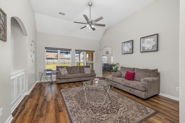 living room with ceiling fan, dark hardwood / wood-style flooring, and lofted ceiling