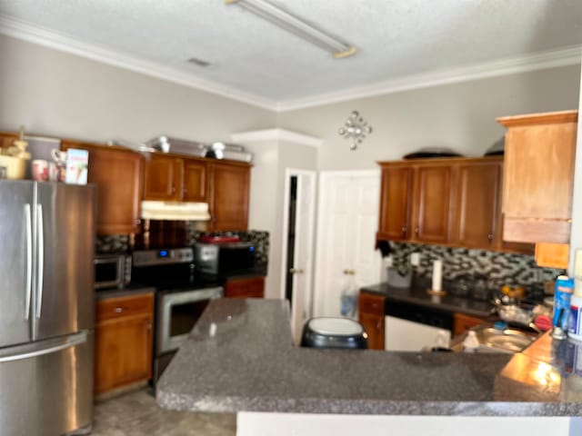 kitchen featuring crown molding, stainless steel appliances, and backsplash