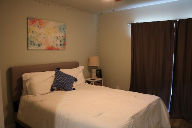 bedroom with hardwood / wood-style floors