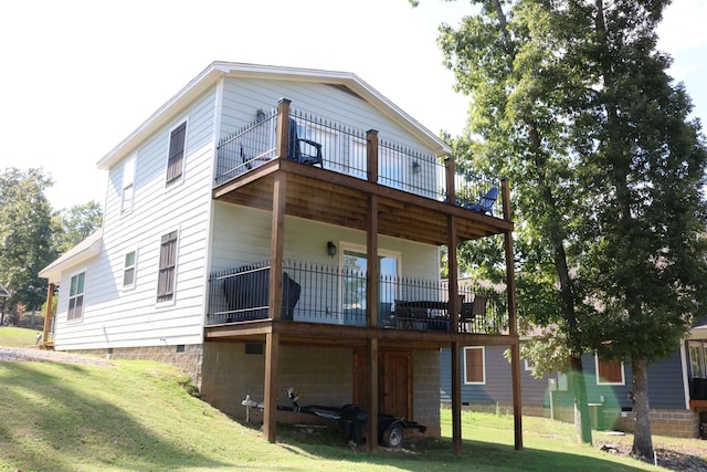 back of house with a lawn