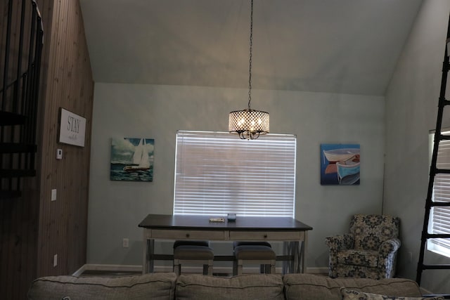 dining space with lofted ceiling