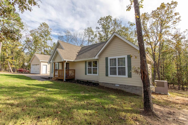 view of front of property featuring a garage and a front lawn