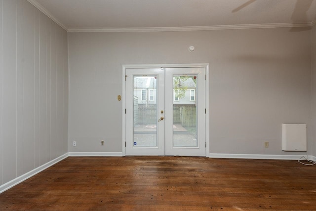 doorway with dark hardwood / wood-style flooring, french doors, and ornamental molding