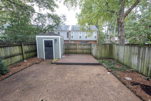 exterior space featuring a deck and a storage shed