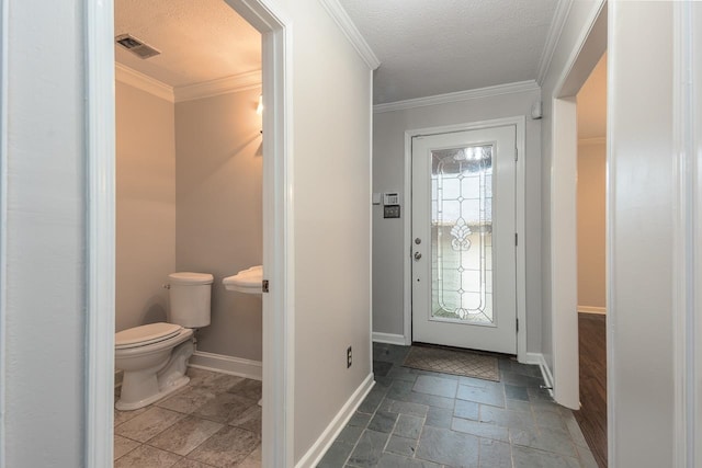 interior space featuring crown molding and a textured ceiling