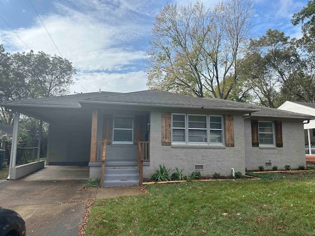 view of front of house featuring driveway, an attached carport, crawl space, and brick siding