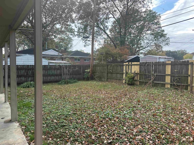 view of yard with a fenced backyard