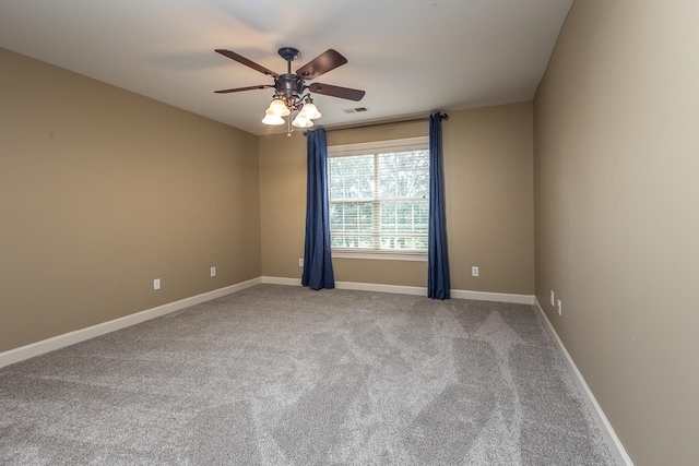 unfurnished room with carpet and ceiling fan