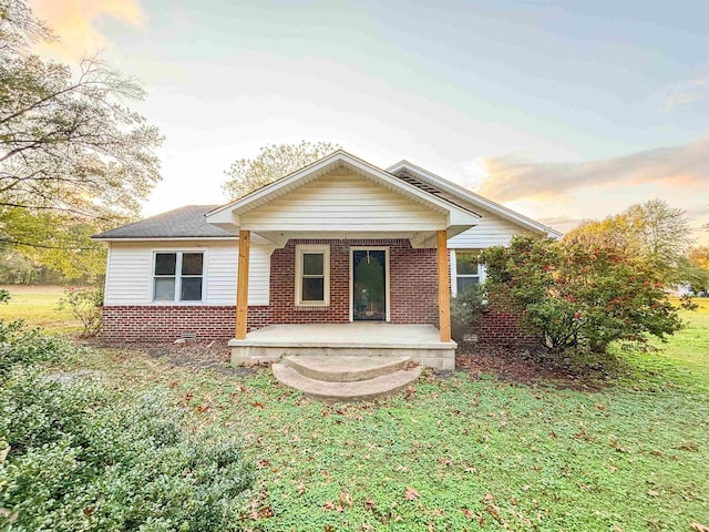 view of front of house with a lawn