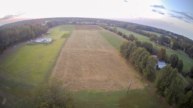 aerial view at dusk featuring a rural view