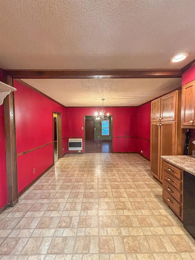 kitchen with hanging light fixtures, a textured ceiling, light stone counters, and heating unit