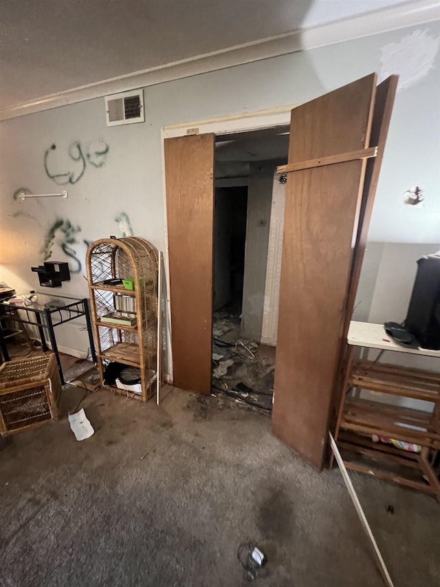 interior space with a closet and visible vents