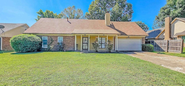 view of front of home featuring a garage and a front lawn