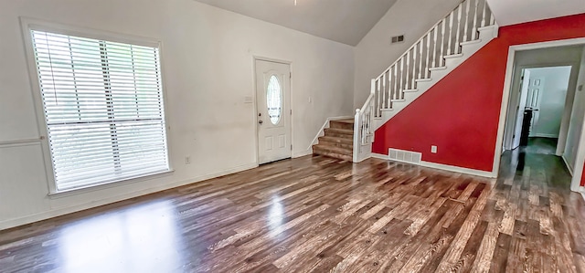 foyer featuring hardwood / wood-style floors and lofted ceiling