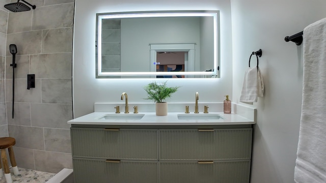 bathroom featuring vanity and tiled shower