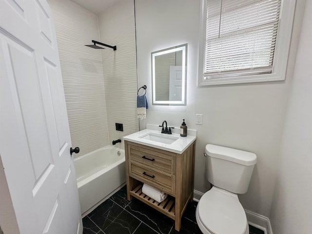 full bathroom featuring toilet, tiled shower / bath combo, and vanity