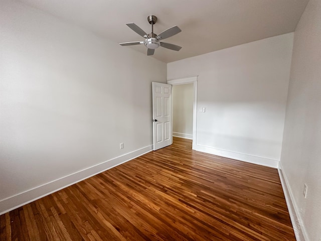 spare room with hardwood / wood-style floors and ceiling fan