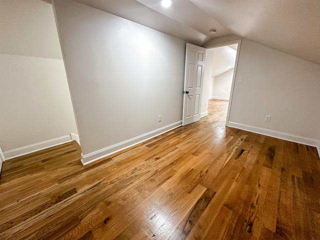 bonus room featuring wood-type flooring and lofted ceiling