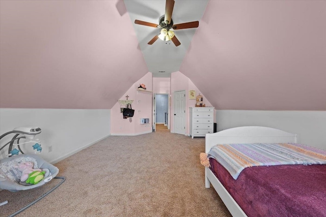 bedroom featuring ceiling fan, vaulted ceiling, and carpet floors