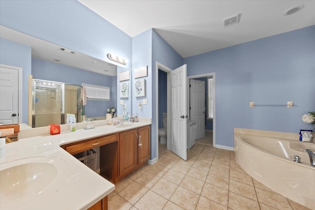 full bathroom featuring separate shower and tub, tile patterned flooring, vanity, and toilet