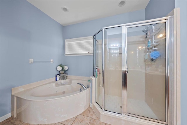 bathroom with shower with separate bathtub and tile patterned floors