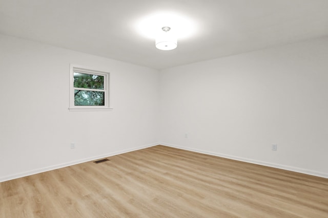 spare room with light hardwood / wood-style floors