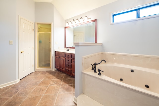 bathroom featuring tile patterned flooring, vanity, lofted ceiling, and shower with separate bathtub