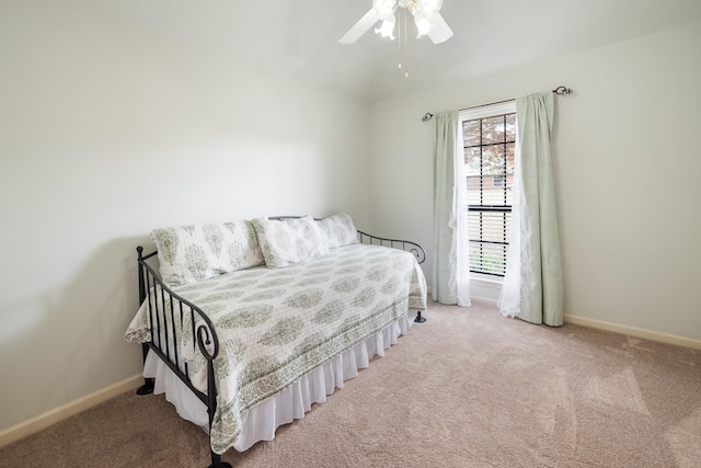 bedroom featuring ceiling fan and light colored carpet