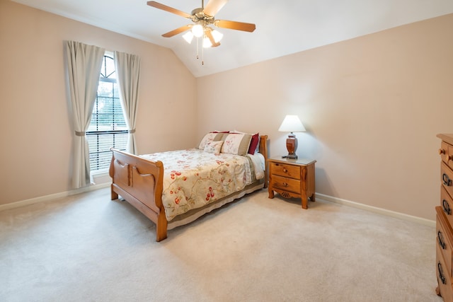 carpeted bedroom with vaulted ceiling and ceiling fan