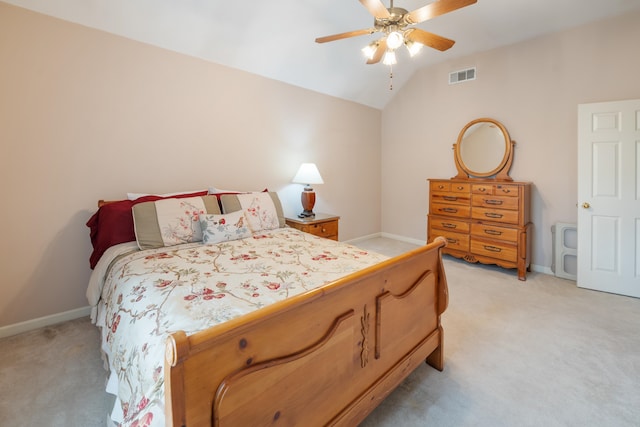 bedroom featuring ceiling fan, lofted ceiling, and light carpet