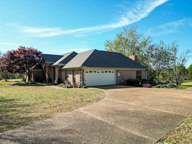 view of front of home featuring a garage and a front lawn