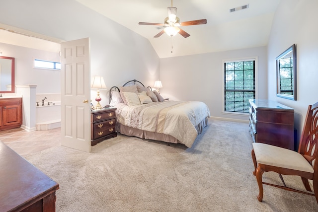 bedroom featuring ceiling fan, lofted ceiling, and light carpet