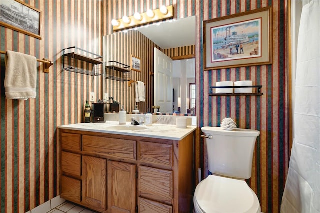 bathroom with toilet and vanity