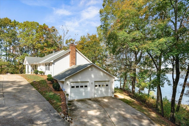 view of side of property featuring a garage