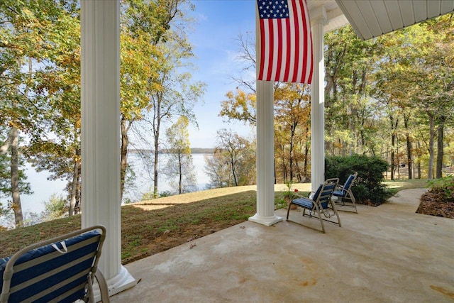 view of patio featuring a water view