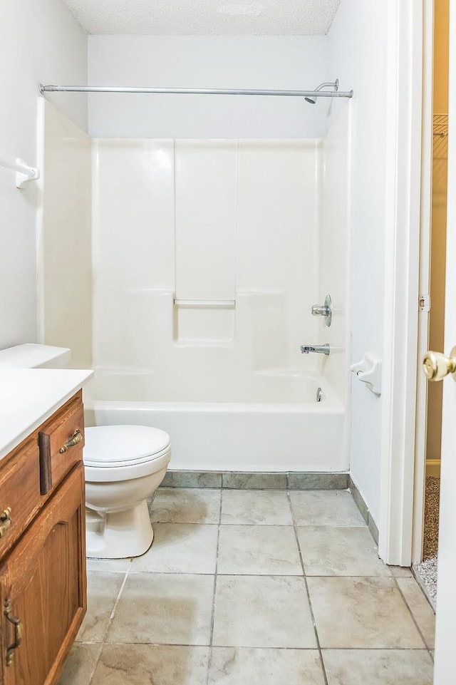 full bathroom featuring vanity, toilet, a textured ceiling, and shower / washtub combination