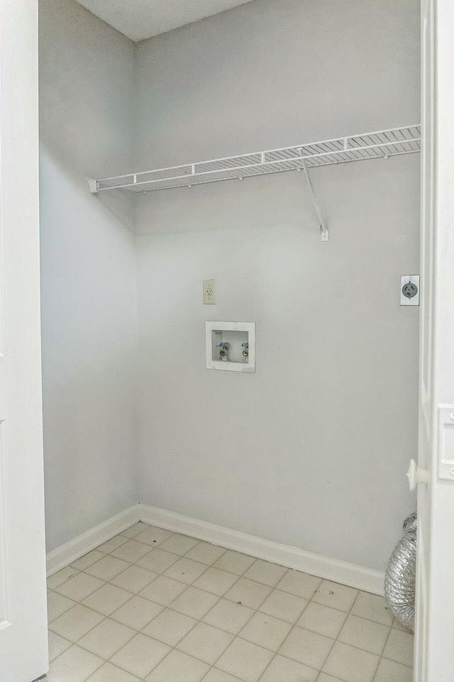 laundry room featuring electric dryer hookup, hookup for a washing machine, and light tile patterned floors