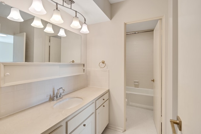 full bathroom featuring tile patterned flooring, shower / bath combination, vanity, and toilet