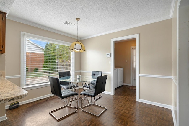 dining space featuring dark parquet flooring, a textured ceiling, and a healthy amount of sunlight