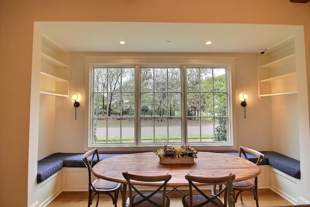 dining room with breakfast area and light hardwood / wood-style flooring