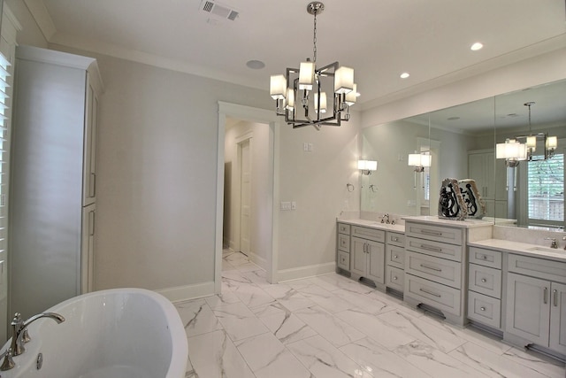 bathroom featuring a bathing tub, vanity, a chandelier, and crown molding