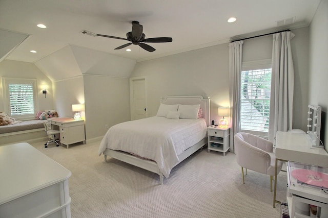 carpeted bedroom featuring vaulted ceiling, ceiling fan, and crown molding